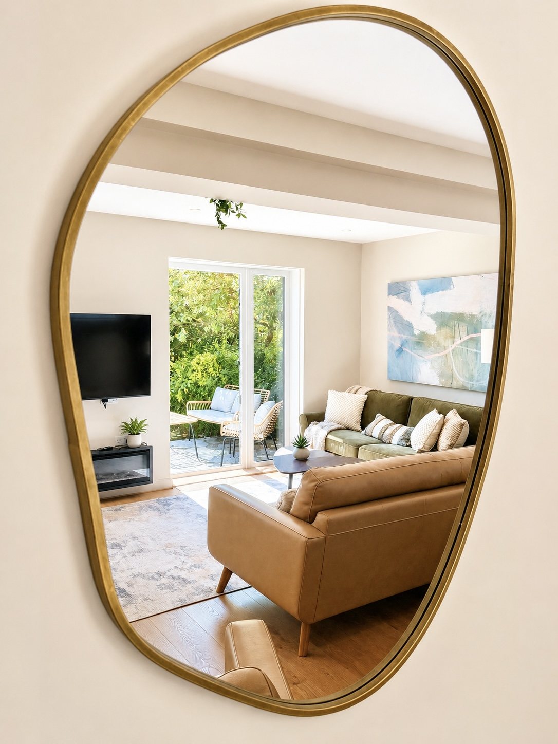 Mirror detail reflecting the warm sitting room at Gulliver's Rest